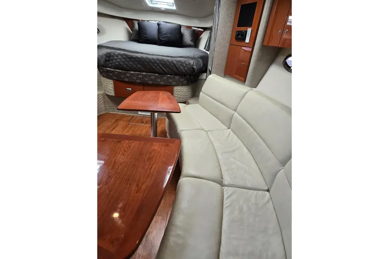 Slide: The Image of Interior of 2007 Formula 34 Performance Cruiser with cozy seating and elegant wood finishes. - 9