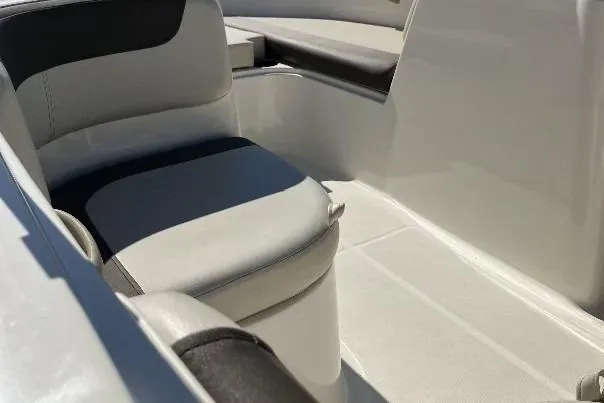 Slide: The Image of 2019 Bayliner Element E16 boat interior with cushioned seating. - 10