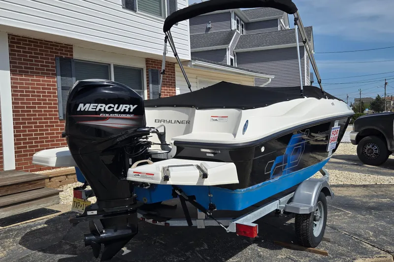 Slide: The Image of 2019 Bayliner Element E16 boat with Mercury engine, parked on trailer, for sale. - 4
