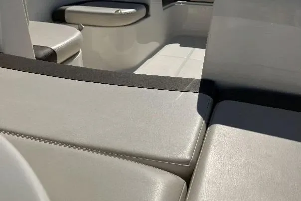 Slide: The Image of 2019 Bayliner Element E16 boat interior with cushioned seating. - 9