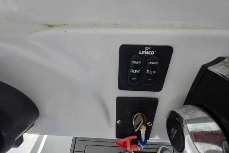 Slide: The Image of Control panel of a 2013 Tidewater 210 LXF boat with Lenco trim tab switches. - 15