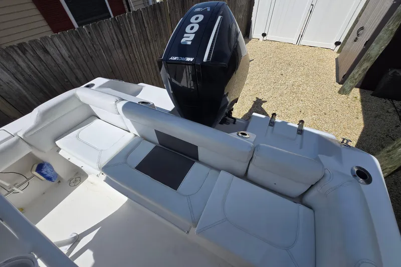 Slide: The Image of 2013 Tidewater 210 LXF boat with Mercury 200 engine, featuring spacious seating area. - 20