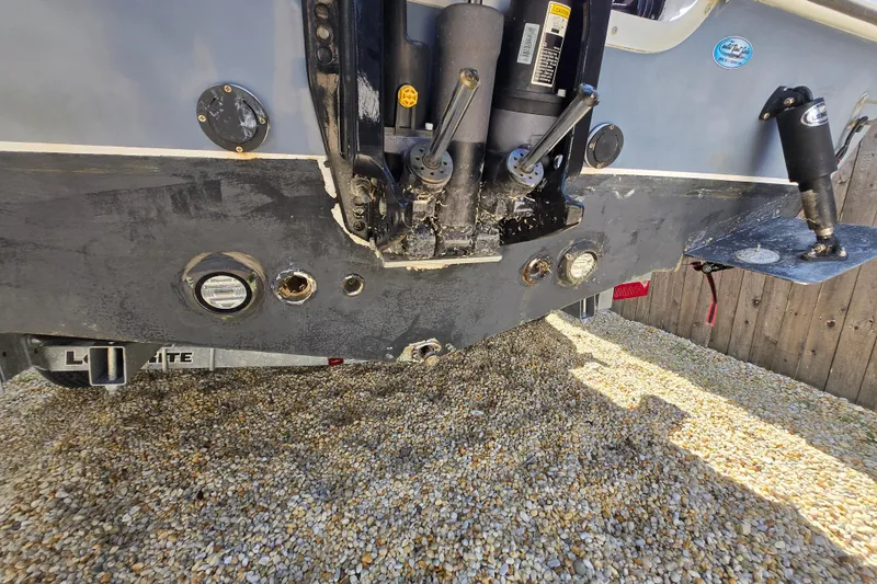 Slide: The Image of Rear view of a 2013 Tidewater 210 LXF boat on gravel surface. - 21