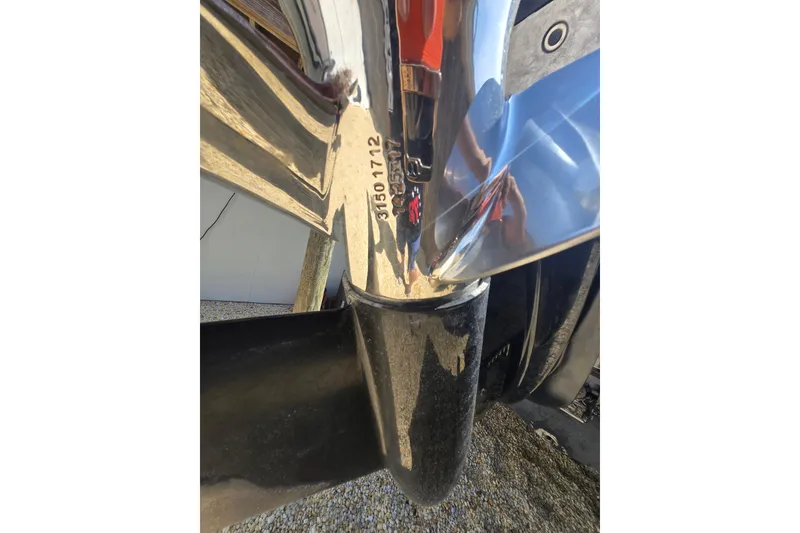 Slide: The Image of Close-up of a 2013 Tidewater 210 LXF boat propeller with visible serial number. - 22