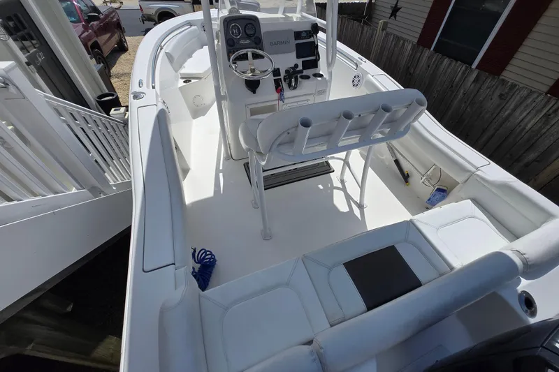 Slide: The Image of 2013 Tidewater 210 LXF boat interior with steering console and seating. - 7