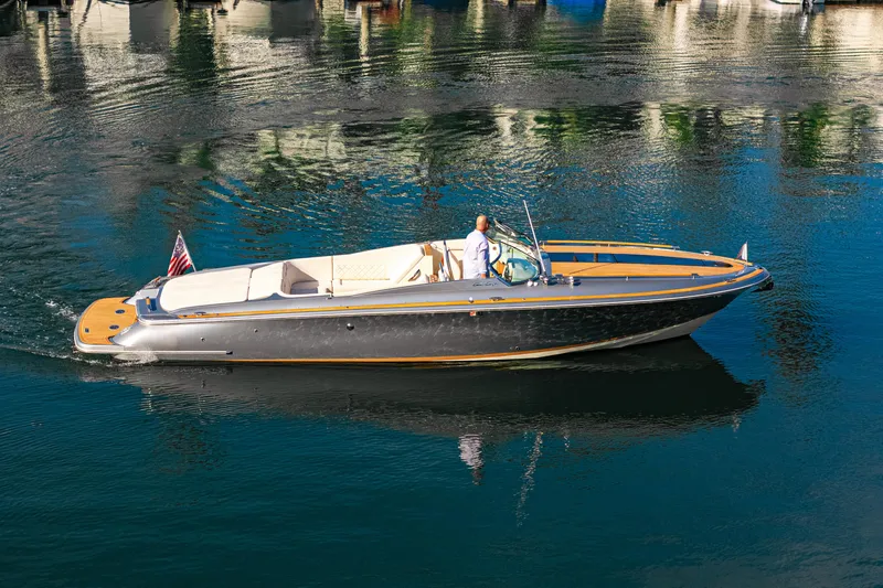 The Image of 2021 Chris-Craft Corsair 34 luxury boat cruising on calm water. - 0