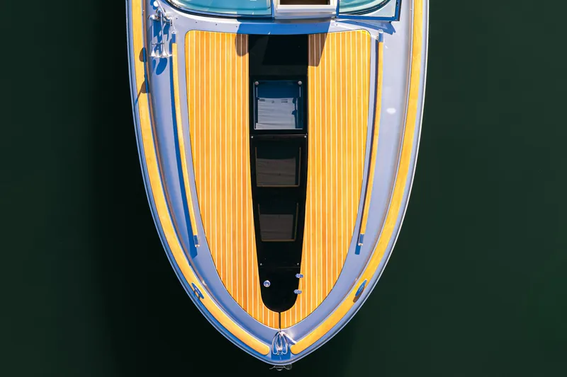 Slide: The Image of Top view of 2021 Chris-Craft Corsair 34 boat with sleek wooden deck design. - 11