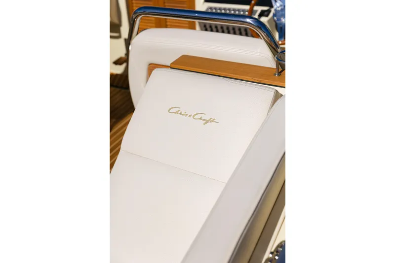 Slide: The Image of Luxurious seating on 2021 Chris-Craft Corsair 34 boat, featuring elegant design and branding. - 15