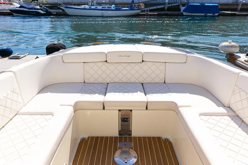 Slide: The Image of Luxurious seating on 2021 Chris-Craft Corsair 34 boat, docked by the water. - 18