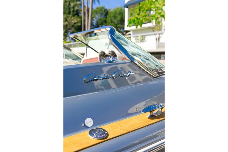 Slide: The Image of 2021 Chris-Craft Corsair 34 boat with sleek design and chrome detailing. - 19