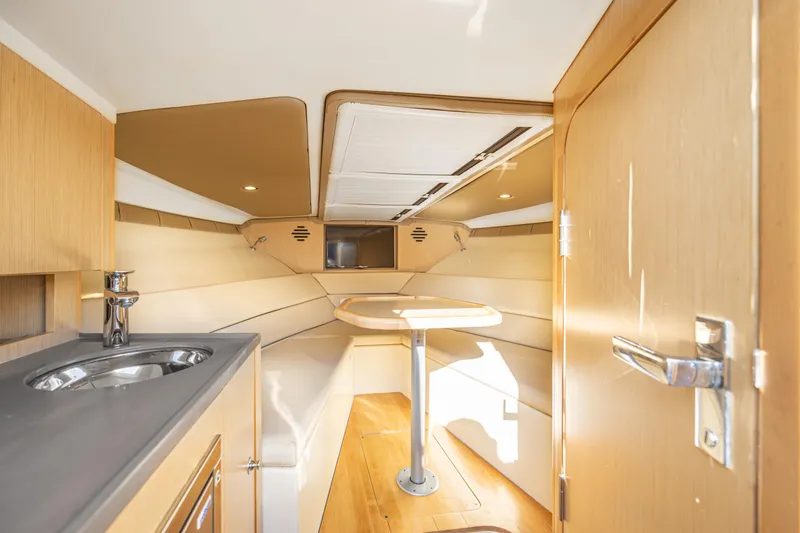 Slide: The Image of Interior of 2021 Chris-Craft Corsair 34, featuring modern design and compact amenities. - 20