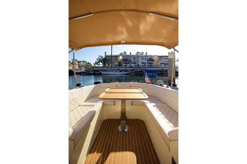 Slide: The Image of 2021 Chris-Craft Corsair 34 interior with elegant seating and waterfront view. - 21