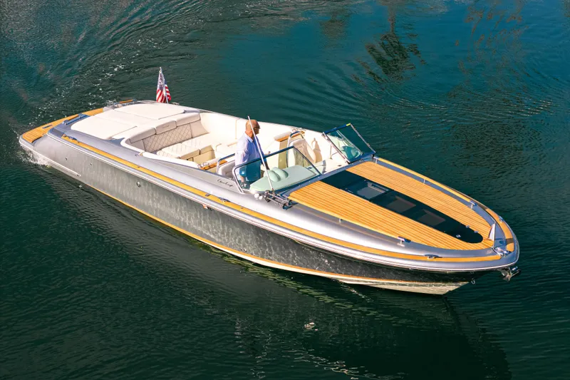 Slide: The Image of 2021 Chris-Craft Corsair 34 luxury boat cruising on calm water. - 8