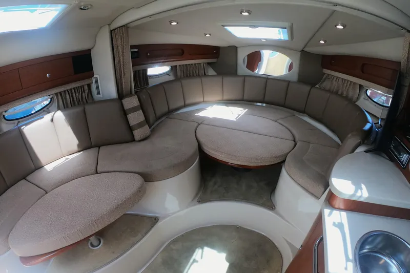 Slide: The Image of Interior of 2003 Chaparral 320 Signature boat with converted circular seating and modern amenities. - 10
