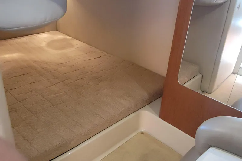 Slide: The Image of Double wide mid berth, full beam Interior cabin of 2003 Chaparral 320 Signature boat. - 12