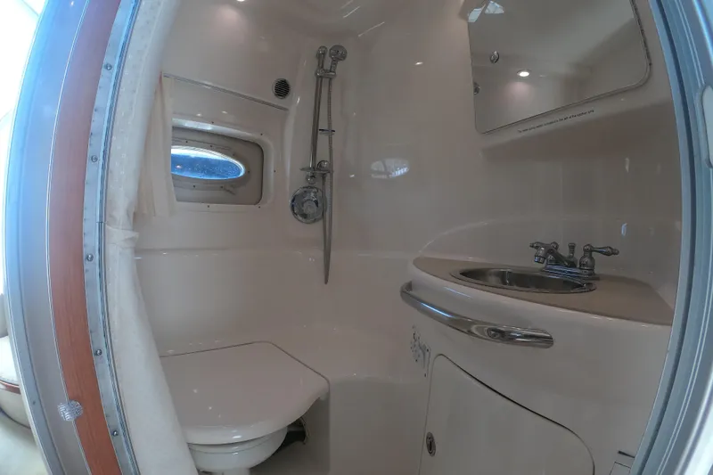 Slide: The Image of Bathroom interior of 2003 Chaparral 320 Signature boat with basin and shower. - 14