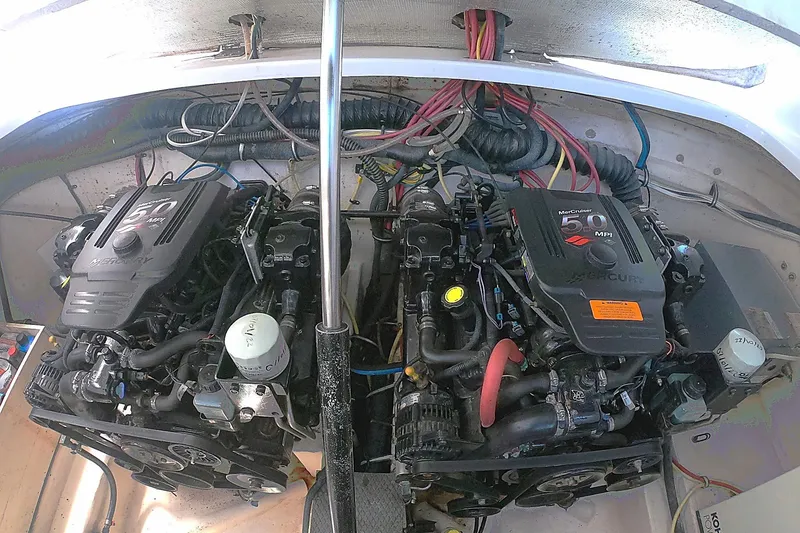 Slide: The Image of Twin MerCruiser 5.0MPI engines in a 2003 Chaparral 320 Signature boat engine compartment. - 15