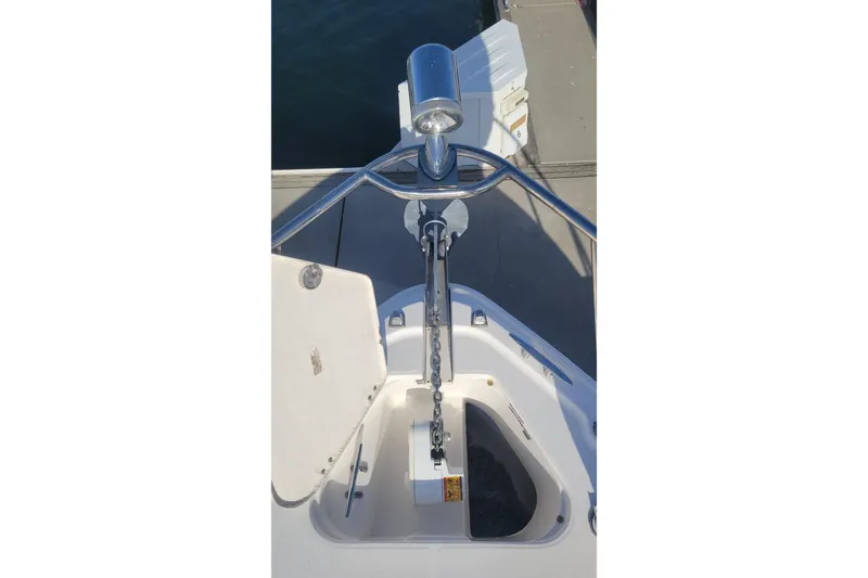 Slide: The Image of 2003 Chaparral 320 Signature boat windlass & spotlight dockside. - 19
