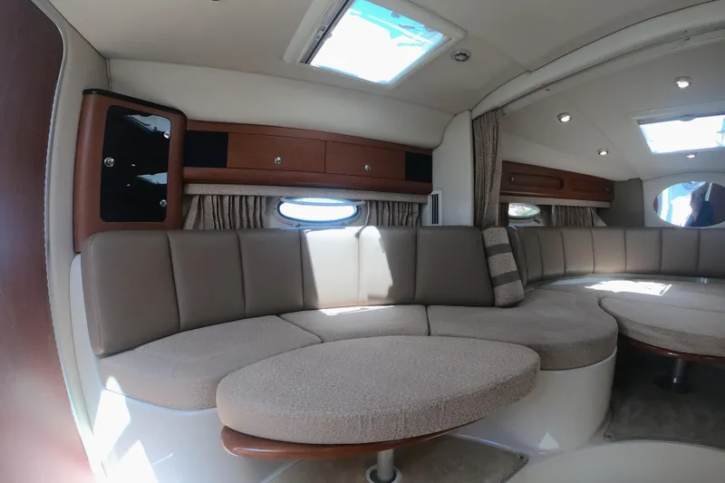 Slide: The Image of Interior of 2003 Chaparral 320 Signature yacht with plush seating and elegant design. - 22