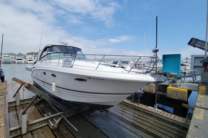 Slide: The Image of 2003 Chaparral 320 Signature boat for sale at marina dock. - 25