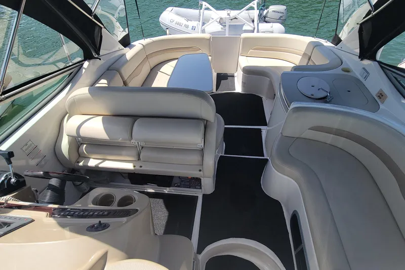 Slide: The Image of Interior of 2003 Chaparral 320 Signature boat with full entertaining, port chaise seating and helm. - 7