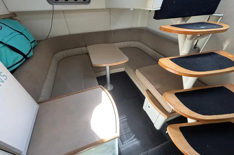Slide: The Image of Interior of 1997 Maxum 4100 SCR yacht with cozy seating and wooden steps. - 12