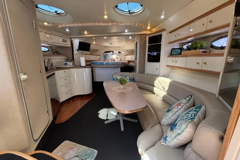 Slide: The Image of Luxurious interior of a 1997 Maxum 4100 SCR yacht with elegant seating and modern amenities. - 14