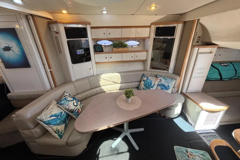 Slide: The Image of Luxurious 1997 Maxum 4100 SCR yacht interior with elegant seating and ocean-themed decor. - 15