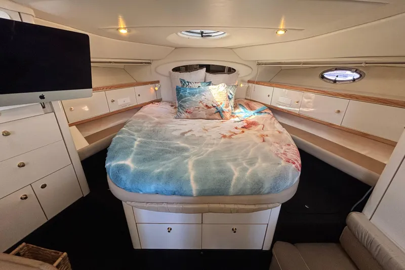 Slide: The Image of Luxurious cabin interior of 1997 Maxum 4100 SCR yacht with cozy bed and modern amenities. - 19
