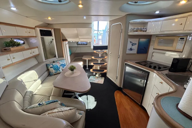 Slide: The Image of Luxurious interior of a 1997 Maxum 4100 SCR yacht with modern amenities and elegant design. - 21