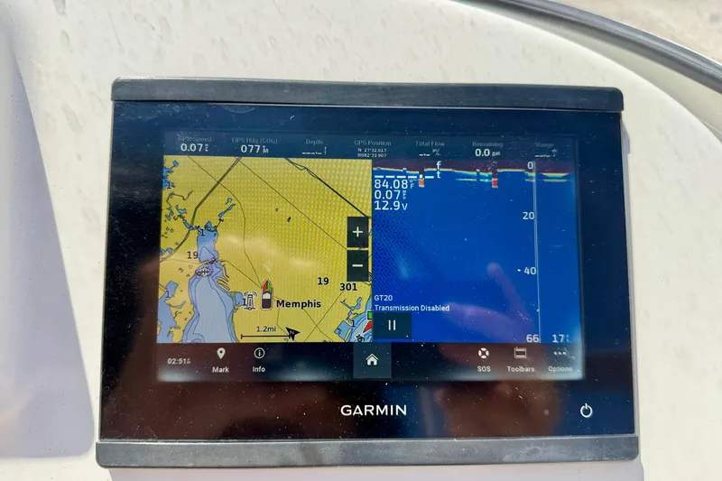 Slide: The Image of Garmin GPS display on 2023 Cobia 220 Dual Console boat, showing navigation and sonar data. - 16