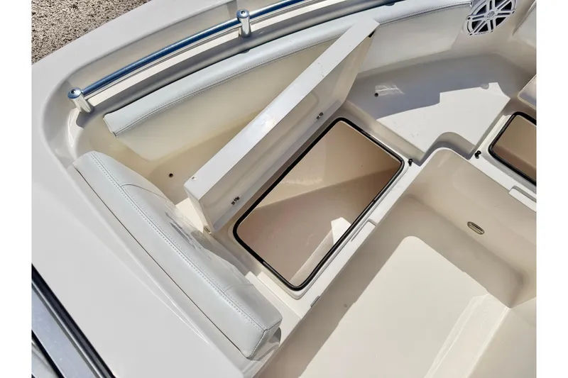 Slide: The Image of 2023 Cobia 220 Dual Console boat interior storage compartments. - 33
