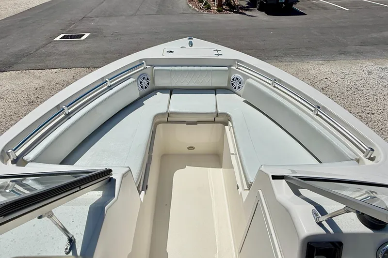Slide: The Image of 2023 Cobia 220 Dual Console boat interior with spacious seating and sleek design. - 9