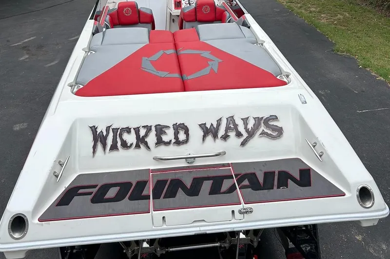 Slide: The Image of 2002 Fountain 38 Lightning boat with "Wicked Ways" text on the rear deck. - 17