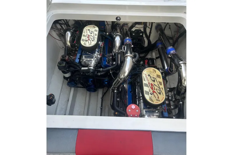 Slide: The Image of Twin engines in a 2002 Fountain 38 Lightning boat, showcasing powerful performance. - 22