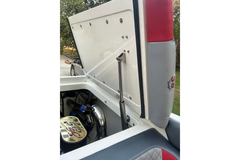 Slide: The Image of Open engine compartment of a 2002 Fountain 38 Lightning boat, showcasing interior details. - 24