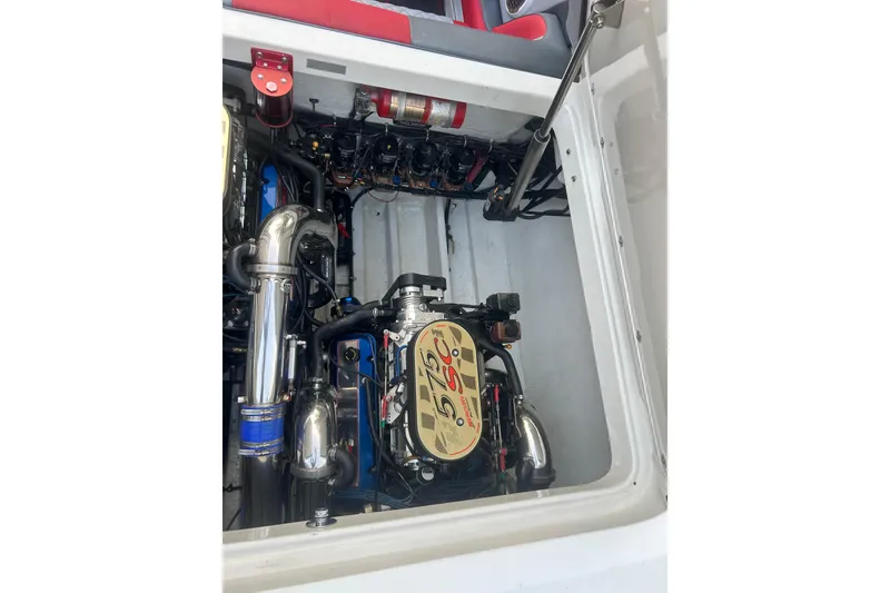 Slide: The Image of Engine compartment of a 2002 Fountain 38 Lightning boat, showcasing a powerful engine setup. - 25
