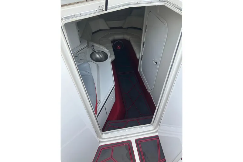 Slide: The Image of Interior view of 2002 Fountain 38 Lightning boat cabin with sink and seating area. - 31