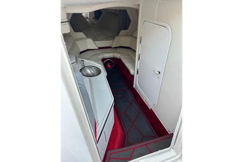 Slide: The Image of Interior of 2002 Fountain 38 Lightning boat with white seating and red accents. - 36