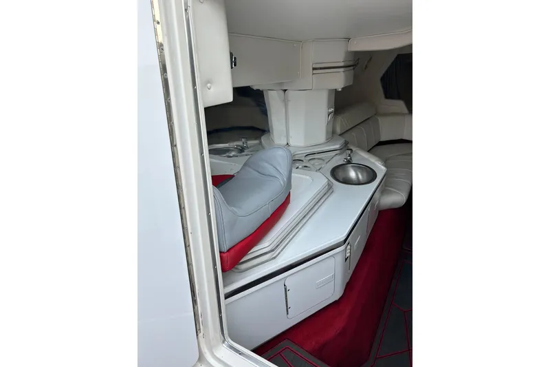 Slide: The Image of Interior of a 2002 Fountain 38 Lightning boat with seating and a small sink. - 37