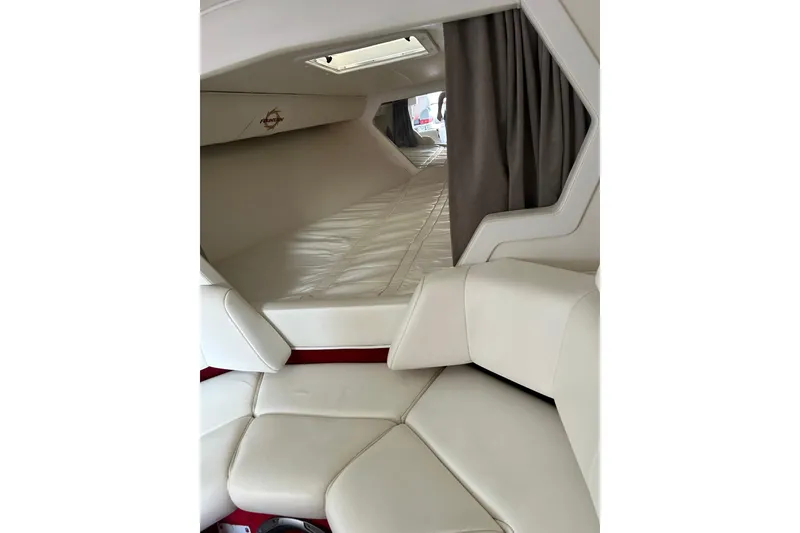 Slide: The Image of Interior of a 2002 Fountain 38 Lightning boat with white leather seating and sleeping area. - 40
