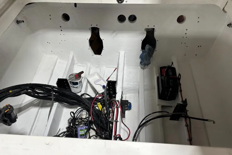 Slide: The Image of Engine compartment of a 2002 Fountain 38 Lightning boat with wiring and components. - 44