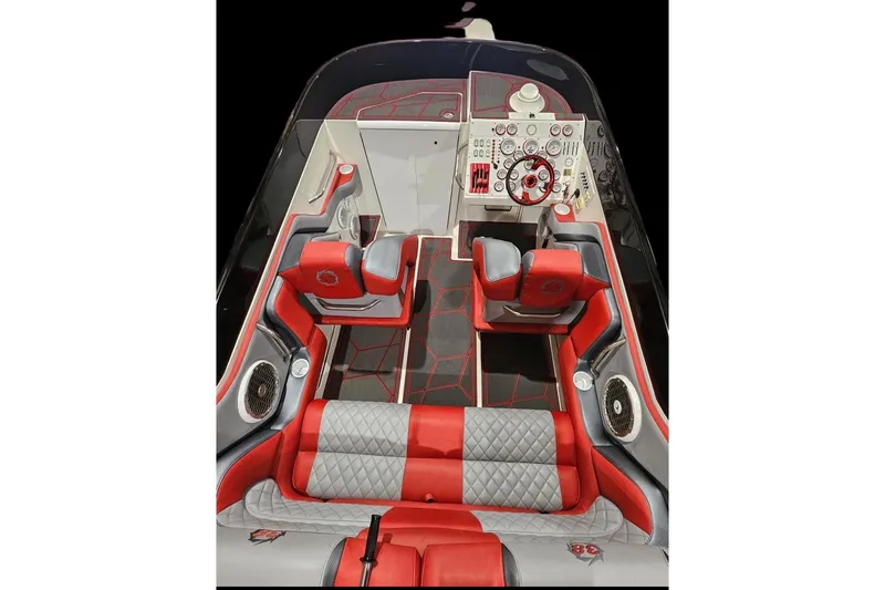 Slide: The Image of Interior of 2002 Fountain 38 Lightning boat with red and gray seating and dashboard. - 45