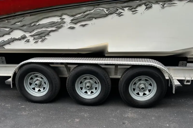 Slide: The Image of Trailer with triple-axle wheels for 2002 Fountain 38 Lightning boat. - 7