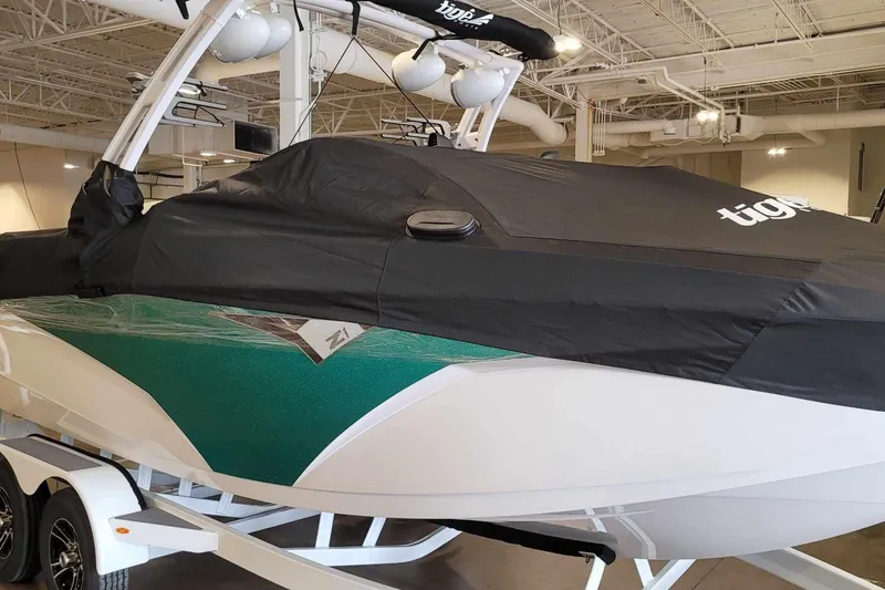 Slide: The Image of 2022 Tigé Z1 boat with cover in indoor showroom. - 10