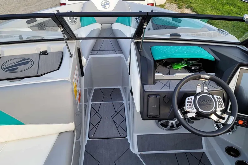 Slide: The Image of 2022 Tigé Z1 boat interior with modern steering wheel and sleek dashboard design. - 13