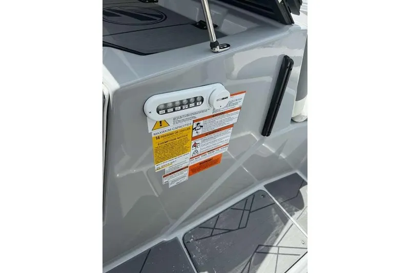 Slide: The Image of 2022 Tigé Z1 boat interior with capacity and safety labels visible. - 14