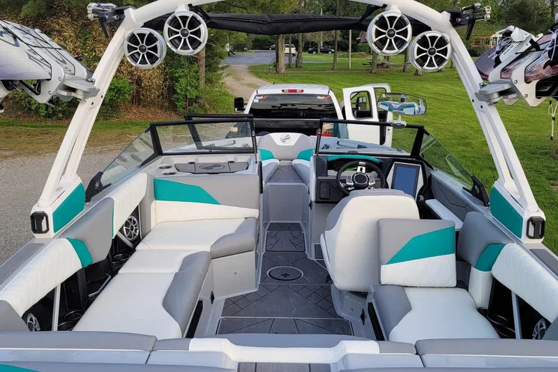 Slide: The Image of 2022 Tigé Z1 boat interior with modern seating and audio system. - 7