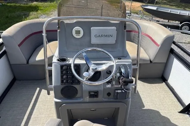 Slide: The Image of 2022 Angler Quest 26 All Sport boat dashboard with Garmin navigation system. - 4