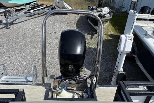 Slide: The Image of 2022 Angler Quest 26 All Sport boat engine and rear deck view. - 9